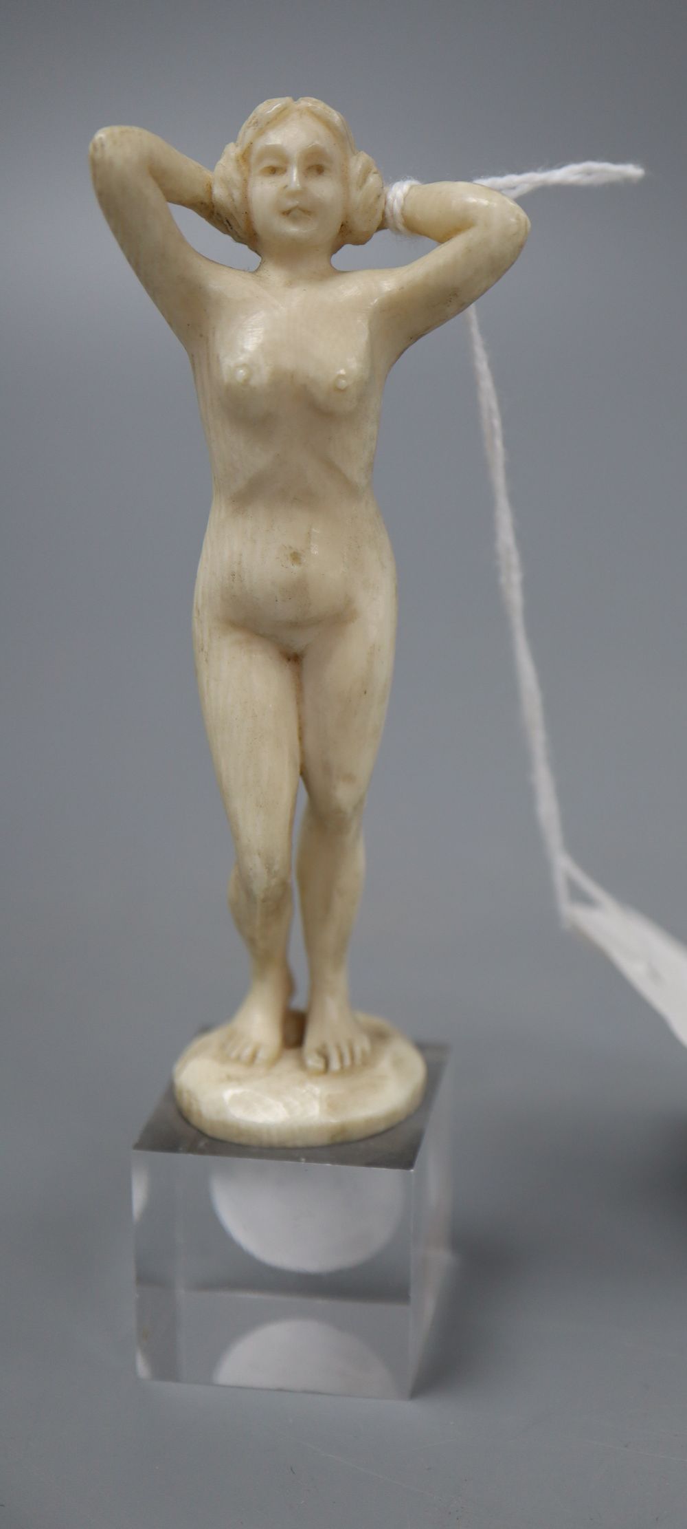 An Art Deco ivory carving of a female nude, unsigned, height 12cm